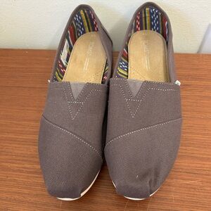 TOMS Gray Canvas Slip-Ons with Patterned Lining